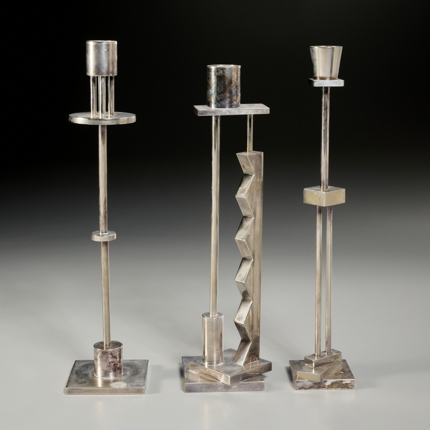 Appraisal: ETTORE SOTTSASS FOR SWID POWELL CANDLESTICKS c s silver-plated brass