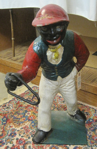 Appraisal: BLACK AMERICANA STYLE LAWN JOCKEY a Jocko style hitching post