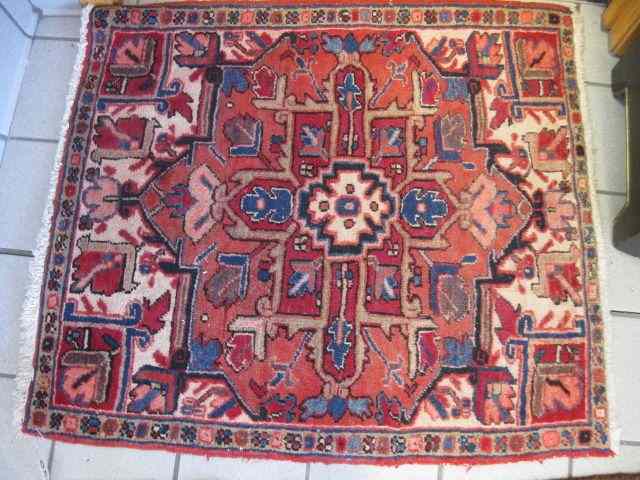 Appraisal: Heriz Persian Handmade Rug central medallion ivory salmon field '