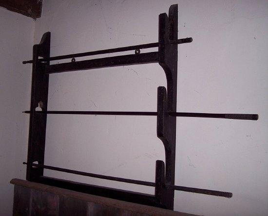 Appraisal: A wallmounted gun rack to take three guns cm wide