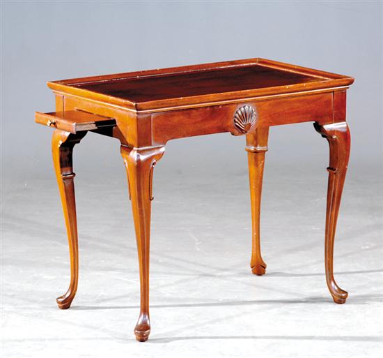 Appraisal: Georgian style carved mahogany tea table th century recessed top