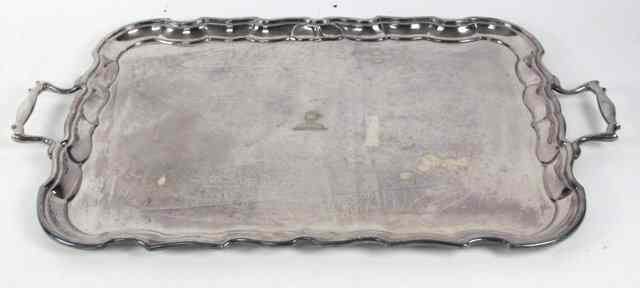 Appraisal: A silver plated twin-handled tray of rectangular shape with pie