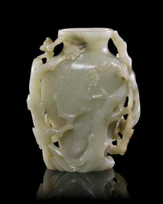 Appraisal: A Carved Jade Vase of pale celadon and grey colored