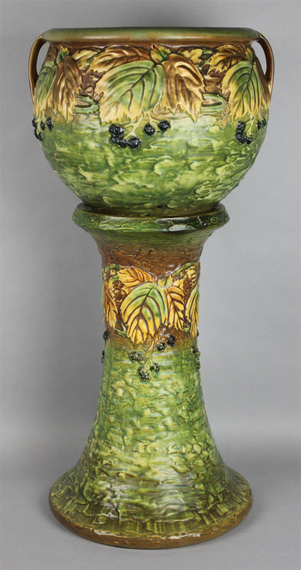 Appraisal: ROSEVILLE BLACKBERRY JARDINIERE AND STAND circa molded with a row