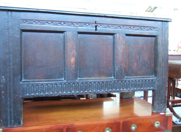 Appraisal: A late th century oak coffer the hinged lid over