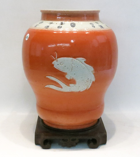 Appraisal: CHINESE PORCELAIN BALUSTER VASE with coral exterior glaze centering incised