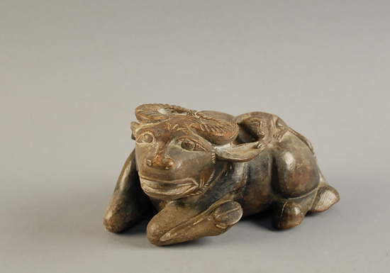 Appraisal: A Chinese Hard Stone Carved Water Buffalo with a monkey