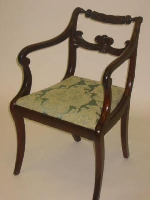 Appraisal: A REGENCY MAHOGANY ELBOW CHAIR the scroll back stiles with