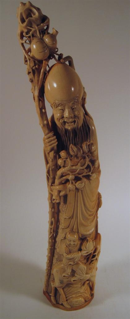 Appraisal: Chinese carved elephant ivory figure of ShoulaoTall slightly convex form