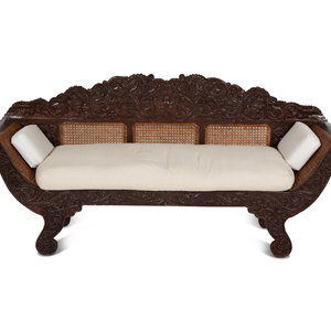 Appraisal: A British Colonial Carved Mahogany and Cane Work Settee Late