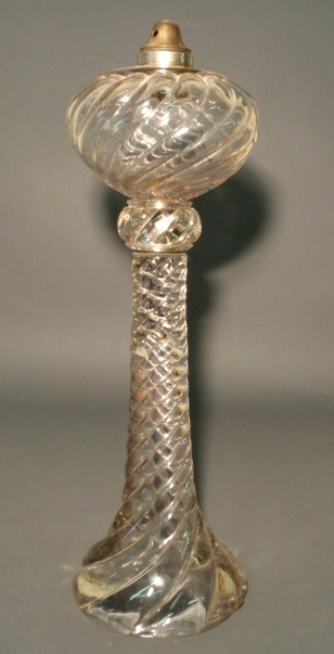 Appraisal: Clear swirl glass oil lamp late th c converted to