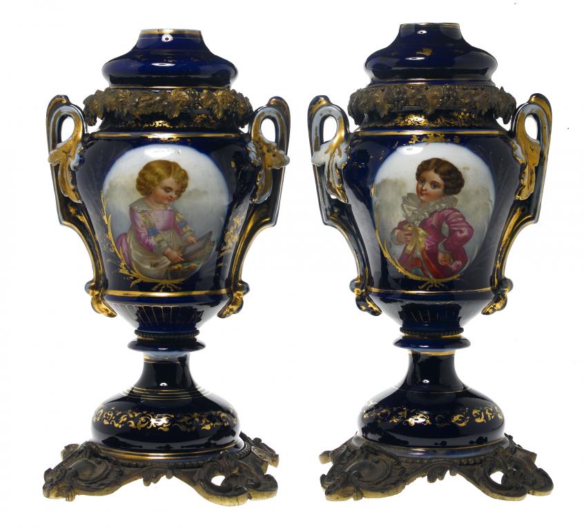 Appraisal: A PAIR OF CONTINENTAL GILTMETAL MOUNTED COBALT GROUND TWO HANDLED