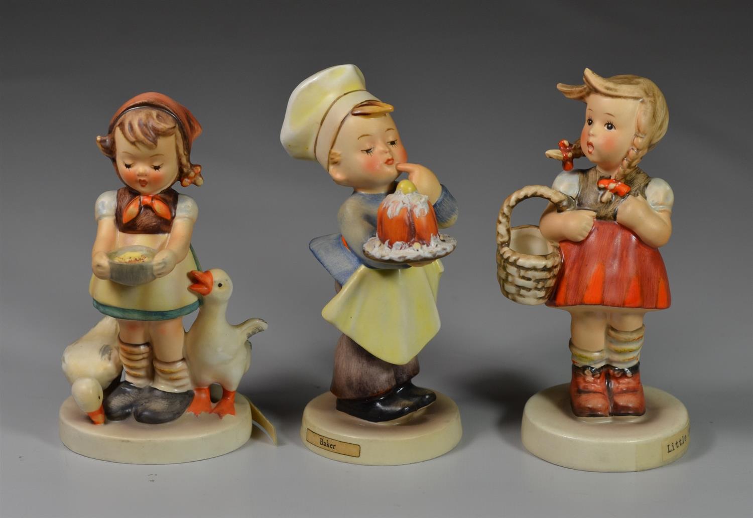 Appraisal: Goebel Hummel Figurines Baker West Germany Be Patient Little Shopper