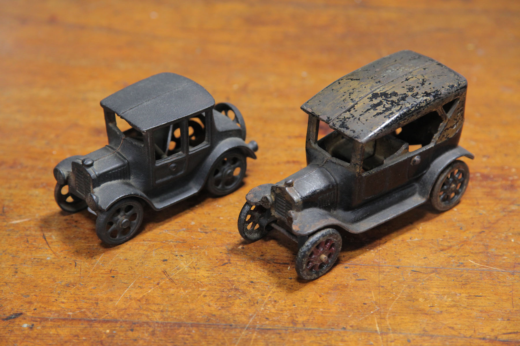 Appraisal: TWO CAST IRON MODEL T'S American early th century An