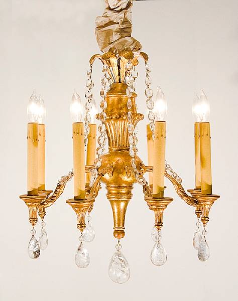 Appraisal: A Rococo style giltwood glass and crystal eight light chandelier