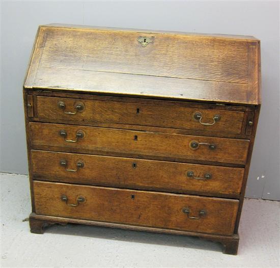 Appraisal: th century oak bureau with a fitted interior four drawers