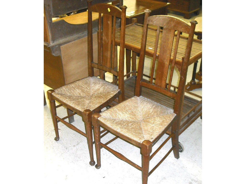 Appraisal: Pair of oak Arts Crafts rush seat dining chairs