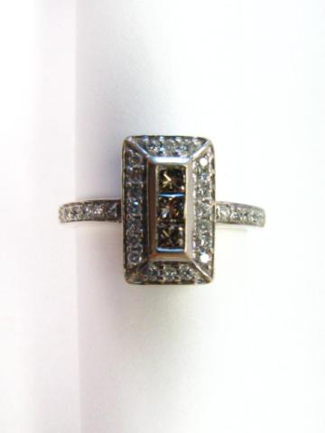 Appraisal: K White Gold Lady's ring with three princess cut champagne