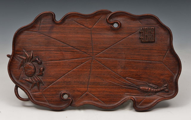 Appraisal: A Chinese wood small traylate th Centurycarved as a lotus