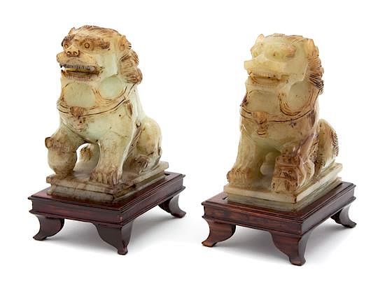 Appraisal: A Pair of Apple Green Jade Foo Lions Height inches