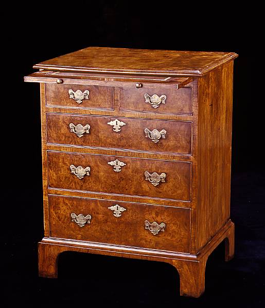 Appraisal: A George III style walnut chest of drawers en suite