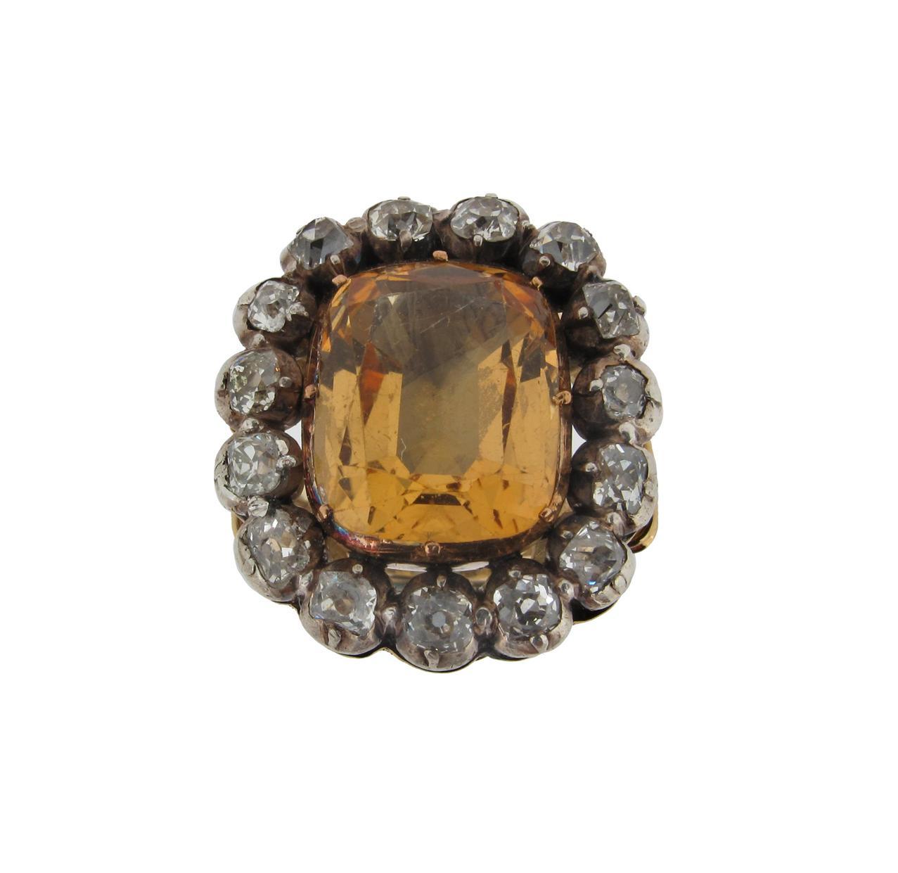 Appraisal: A topaz and diamond cluster ring