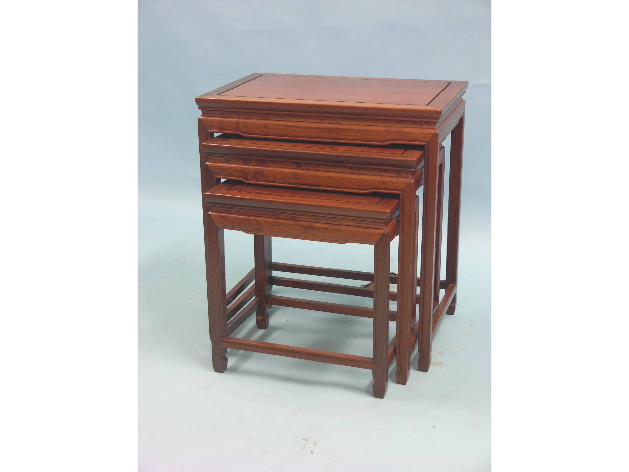 Appraisal: A Chinese rosewood nest of three tables rectangular with moulded