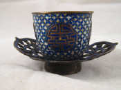 Appraisal: A Chinese miniature silver cloisonn enamelled cup and pierced saucer