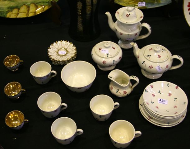 Appraisal: A part miniature teaset together with three continental porcelain cabinet