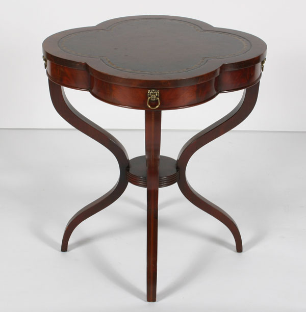 Appraisal: Mahogany leather top lamp table cloverleaf shaped top brass pulls