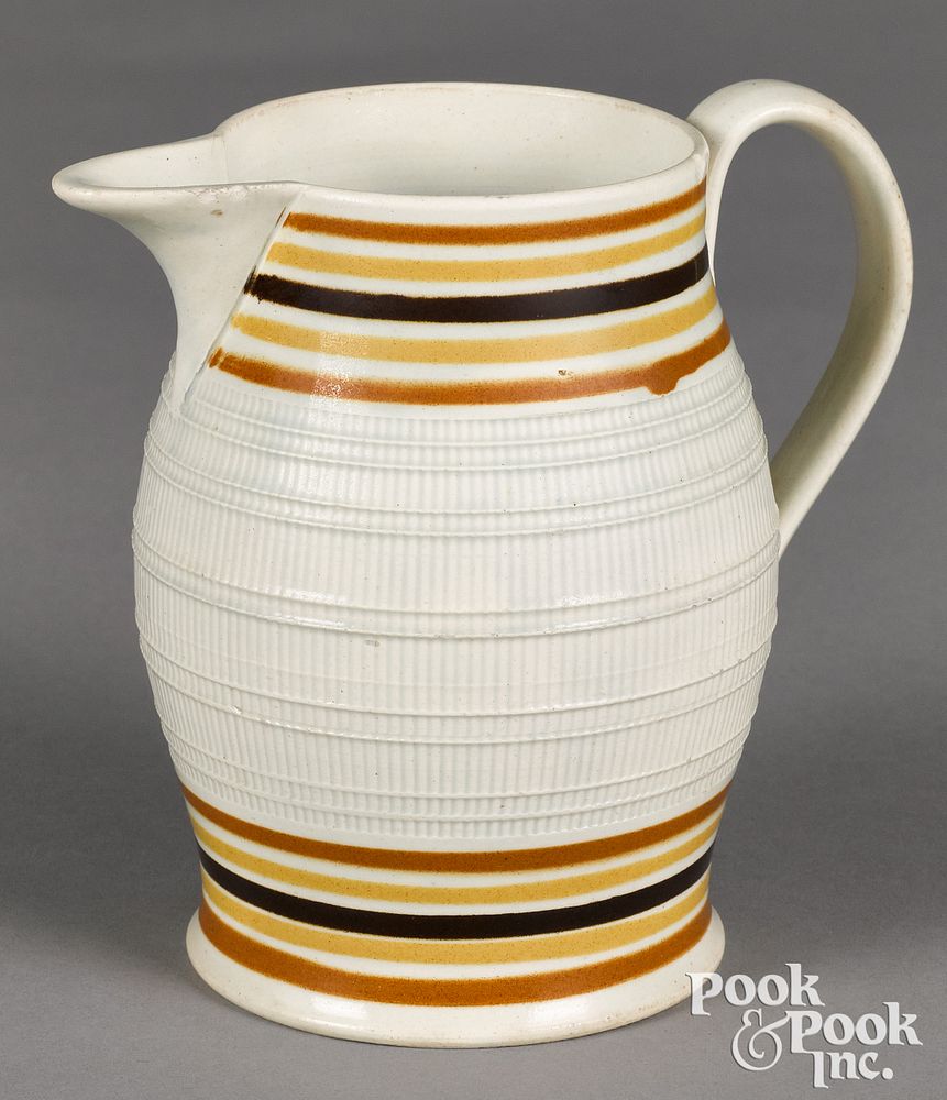 Appraisal: Mocha pitcher Mocha pitcher with raised crisscrossed ivory surface h