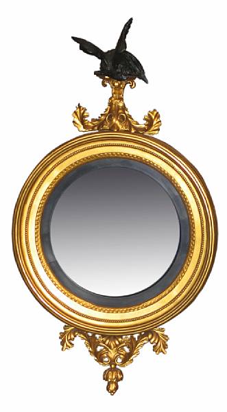 Appraisal: A Classical style giltwood convex mirror height in width in