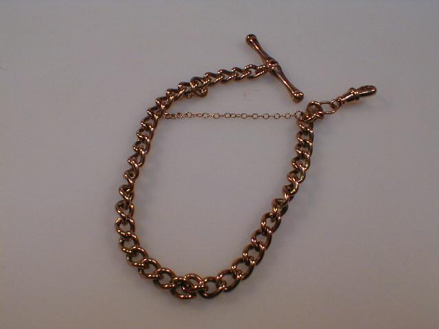 Appraisal: A ct rose gold curb link bracelet with attached T