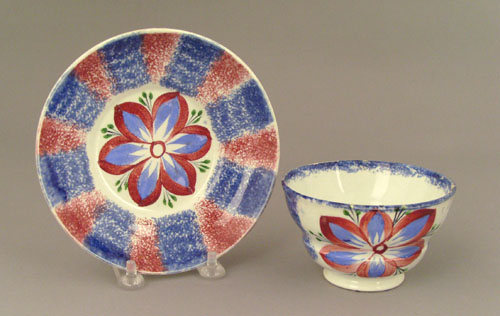 Appraisal: Red and blue rainbow spatter cup and saucer th c