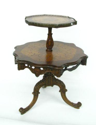 Appraisal: French Style Inlaid Tea Table ornate carvings and reticulated brass