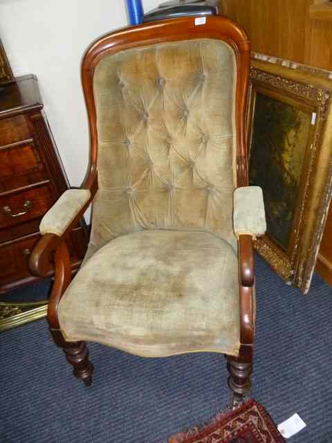 Appraisal: A VICTORIAN MAHOGANY LIBRARY OPEN ARMCHAIR with overstuffed button upholstered