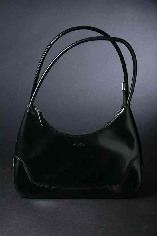 Appraisal: PRADA BLACK LEATHER HANDBAG Black fabric interior with zipper pockets