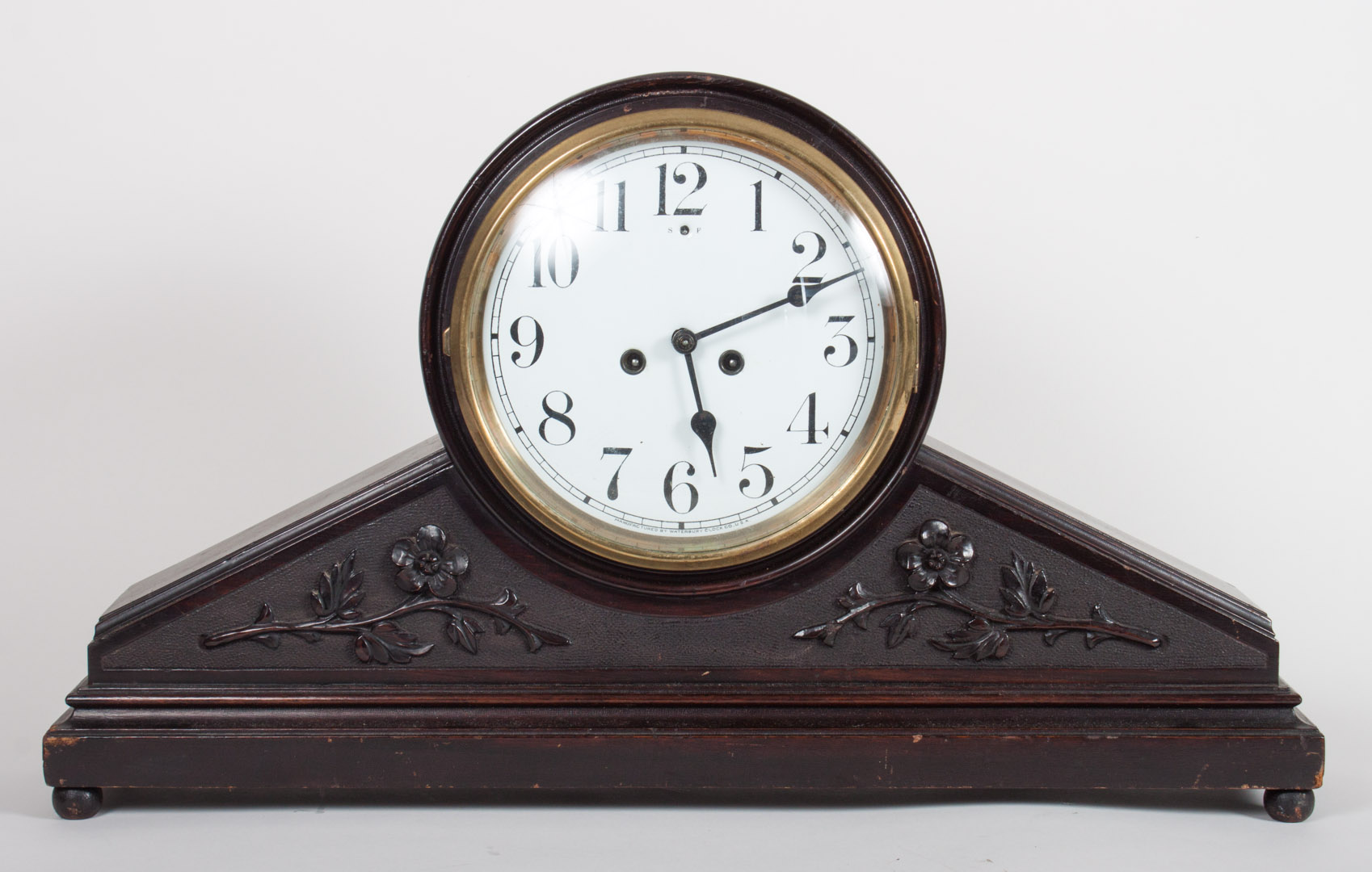 Appraisal: Waterbury mahogany mantel clock late th century with carved floral