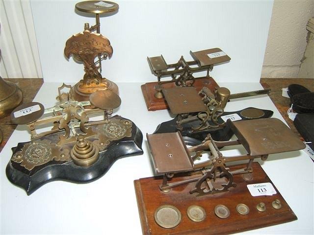 Appraisal: A SET OF VICTORIAN BRASS POSTAL SCALES on a shaped