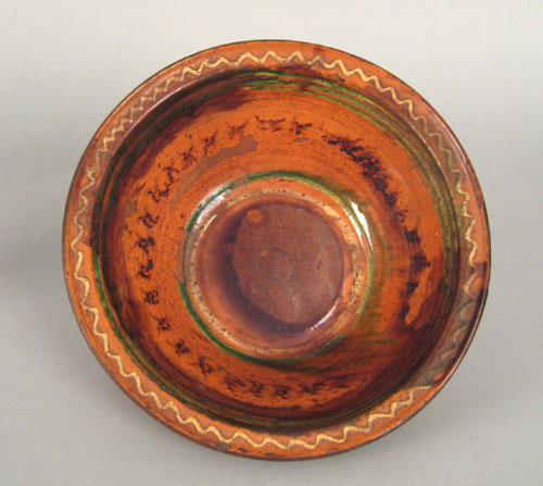 Appraisal: Pennsylvania or Maryland redware bowl th c with yellow and