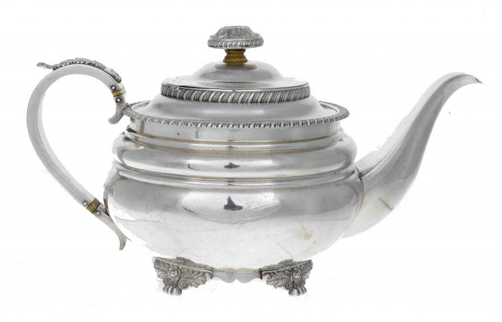 Appraisal: A GEORGE IV TEAPOT of gadrooned circular form the domed