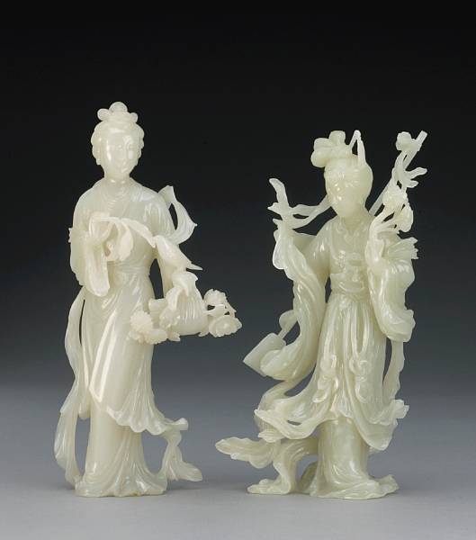 Appraisal: Two white jade maidens Each of the ethereal beauties displaying