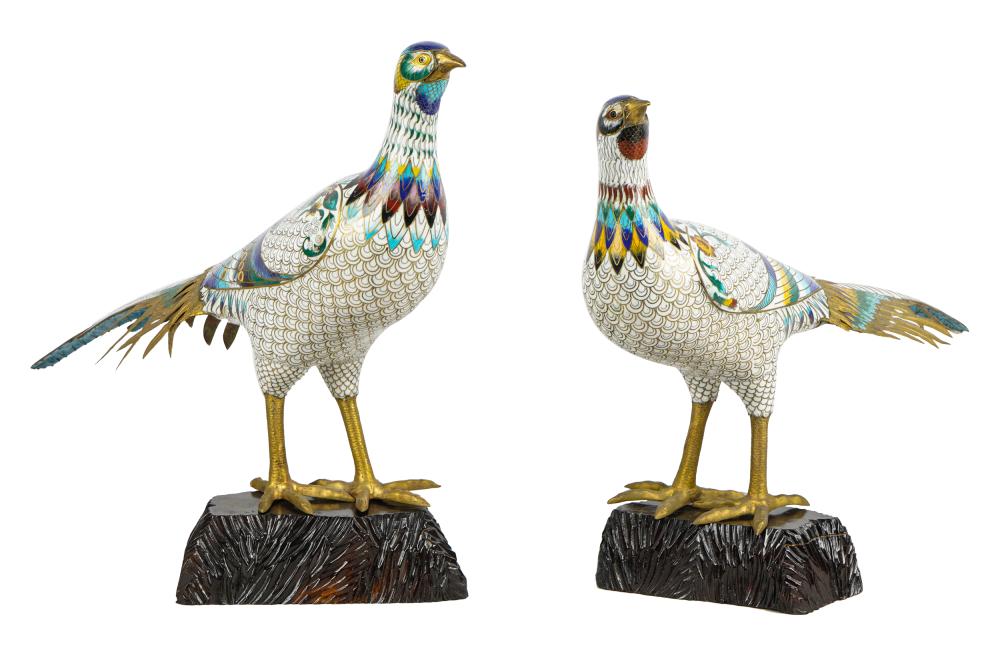 Appraisal: PAIR OF CLOISONNE ENAMELED PHEASANTSeach set on a carved and