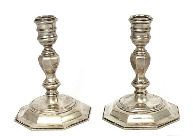 Appraisal: A pair of silver candlesticks each in a mid th