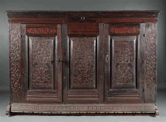 Appraisal: George II carved oak cabinet carved date floral sunflower and