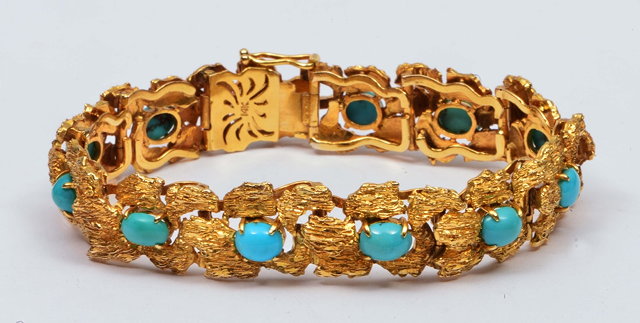 Appraisal: Iranian k gold braceletof stylised form with inset turquoise decoration