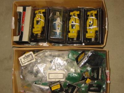 Appraisal: Five Scalextric cars boxed and a quantity of tagged Scalextric