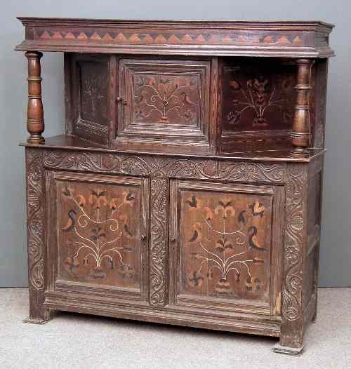 Appraisal: A th Century panelled oak court cupboard inlaid with two