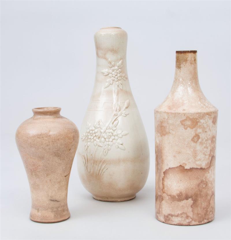 Appraisal: THREE CREAM-GLAZED STONEWARE VASES The smallest with label 'Bluett Sons