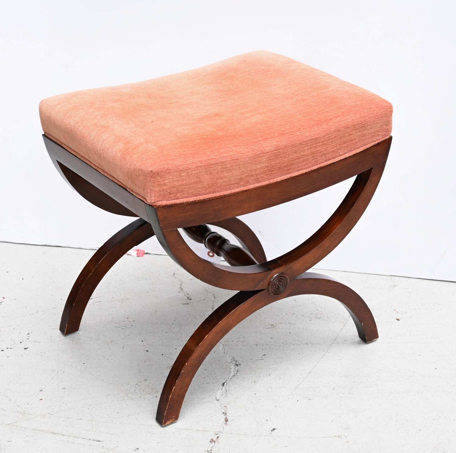 Appraisal: MAHOGANY CURULE UPHOLSTERED STOOL th c with pink upholstered seat